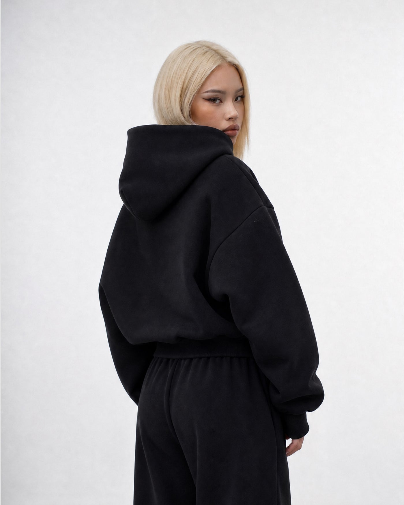 HEAVY ZIP V2 Deep Black — on model three-quarter back
